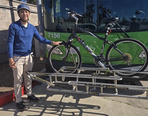 Man standing next to bike rack in front of Culver CityBus 
